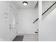 Bright foyer features white walls, a decorative front door, and access to the staircase at 6703 Wimbledon Dr, Zionsville, IN 46077