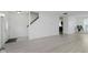 Spacious room boasting modern floors and ample natural light, perfect for relaxing or entertaining guests at 6703 Wimbledon Dr, Zionsville, IN 46077