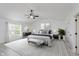 Serene main bedroom with a ceiling fan, neutral decor, and abundant natural light at 6703 Wimbledon Dr, Zionsville, IN 46077
