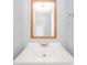 Bathroom sink with a wooden framed mirror and a matching towel rack for a stylish and cohesive look at 6863 W Jennifer Ct, Greenfield, IN 46140