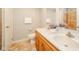 Spacious bathroom with double vanity, ceramic tile floors, and a separate shower stall for convenience at 6863 W Jennifer Ct, Greenfield, IN 46140