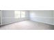 Spacious bedroom featuring updated paint and trim, complemented by cozy carpet flooring at 6863 W Jennifer Ct, Greenfield, IN 46140