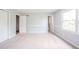 Bright bedroom with carpet, natural light, and neutral paint ready for your design touches at 6863 W Jennifer Ct, Greenfield, IN 46140
