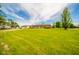 Expansive property showcasing the home, detached garage, and lush lawn at 6863 W Jennifer Ct, Greenfield, IN 46140