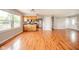 Open concept kitchen and living room with stainless steel appliances and hardwood flooring at 6863 W Jennifer Ct, Greenfield, IN 46140