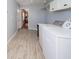 Functional laundry room with modern appliances and well-maintained flooring throughout the space at 6863 W Jennifer Ct, Greenfield, IN 46140