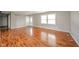 Neutral living room with gleaming hardwood floors and natural light at 6863 W Jennifer Ct, Greenfield, IN 46140