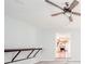 Bright living room featuring a modern ceiling fan and doorway to the kitchen at 6863 W Jennifer Ct, Greenfield, IN 46140