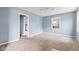 Cozy bedroom with neutral carpet and a ceiling fan, offering a comfortable and relaxing space at 703 Kappes St, Indianapolis, IN 46221