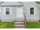 Close-up of the home's entrance highlighting the classic white door and inviting front porch at 703 Kappes St, Indianapolis, IN 46221