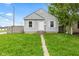 Charming single-story home with gray siding, white trim, and a well-maintained lawn at 703 Kappes St, Indianapolis, IN 46221