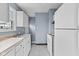 Well-lit kitchen with white cabinetry, sleek countertops, and modern appliances at 703 Kappes St, Indianapolis, IN 46221