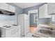 A spacious kitchen with modern appliances and a view into a bright living space at 703 Kappes St, Indianapolis, IN 46221
