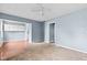 Inviting living room with a ceiling fan, combination flooring, and a practical layout at 703 Kappes St, Indianapolis, IN 46221