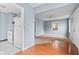 Inviting living room featuring fresh paint, a ceiling fan, and large window providing natural light at 703 Kappes St, Indianapolis, IN 46221