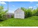 Backyard shed surrounded by grass and foliage at 703 Kappes St, Indianapolis, IN 46221
