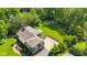 Aerial view of the property showcases lush greenery, well-maintained landscaping, and a cozy home at 7035 Creekside Ln, Indianapolis, IN 46220