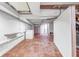 Open basement area with tiled flooring, white cinder block walls and storage at 7035 Creekside Ln, Indianapolis, IN 46220