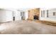 Spacious basement featuring a brick fireplace and built in storage at 7035 Creekside Ln, Indianapolis, IN 46220