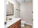 Bathroom with a wood vanity, white countertop, and neutral walls offering a clean and functional space at 7035 Creekside Ln, Indianapolis, IN 46220
