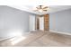 Bedroom featuring an accent brick wall and neutral paint at 7035 Creekside Ln, Indianapolis, IN 46220