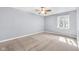 Neutral bedroom with carpeted floor and ceiling fan at 7035 Creekside Ln, Indianapolis, IN 46220