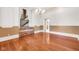 Dining room with hardwood floors, brick fireplace, and an open doorway, providing a spacious layout at 7035 Creekside Ln, Indianapolis, IN 46220