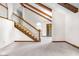 Open floor plan featuring staircase, wood trim, mosaic tile and double door entrance at 7035 Creekside Ln, Indianapolis, IN 46220
