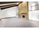 Spacious living room with soaring ceilings, brick fireplace, and wooden beams at 7035 Creekside Ln, Indianapolis, IN 46220