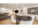 Finished basement with entertainment and dining areas and sleek hardwood floors at 7887 Meadowbrook Dr, Indianapolis, IN 46240