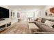 Finished basement with entertainment area, dining area, and hardwood floors at 7887 Meadowbrook Dr, Indianapolis, IN 46240