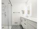 Contemporary bathroom with glass enclosed shower and a white vanity with drawers at 7887 Meadowbrook Dr, Indianapolis, IN 46240