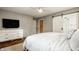 Relaxing bedroom featuring a queen-size bed, built-in storage and ample natural light at 7887 Meadowbrook Dr, Indianapolis, IN 46240