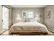 Inviting bedroom with a queen-size bed, stylish bedside lamps, and ample natural light at 7887 Meadowbrook Dr, Indianapolis, IN 46240