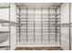 Walk-in closet with an open wire shelving system and unique flooring at 7887 Meadowbrook Dr, Indianapolis, IN 46240