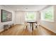 This dining area features light hardwood floors, white walls, and a dark wood table with chairs at 7887 Meadowbrook Dr, Indianapolis, IN 46240