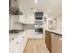 Modern kitchen featuring stainless steel appliances, custom cabinetry, and stylish backsplash at 7887 Meadowbrook Dr, Indianapolis, IN 46240