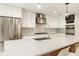 Bright kitchen with white cabinets, large island, and stainless steel appliances at 7887 Meadowbrook Dr, Indianapolis, IN 46240