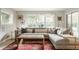 Cozy living room featuring a large sectional sofa, decorative pillows, and natural light at 7887 Meadowbrook Dr, Indianapolis, IN 46240
