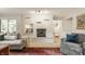 Relaxing living room featuring a brick fireplace, large sofa, and stylish area rug at 7887 Meadowbrook Dr, Indianapolis, IN 46240
