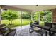 Inviting covered patio with comfortable seating and a view of the spacious backyard at 7887 Meadowbrook Dr, Indianapolis, IN 46240