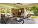 Inviting porch with modern furniture and views of the well-kept neighborhood at 7887 Meadowbrook Dr, Indianapolis, IN 46240