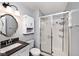 Cozy bathroom featuring walk in shower, vanity, and storage at 8024 Sunfield Ct # 5-B, Indianapolis, IN 46214