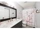 Bathroom featuring dark vanity and marble countertop at 8024 Sunfield Ct # 5-B, Indianapolis, IN 46214