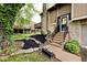 Inviting home entrance with stone accents, flower beds, and well-maintained landscaping at 8024 Sunfield Ct # 5-B, Indianapolis, IN 46214