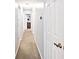 Bright hallway featuring neutral paint, carpeted floors and white doors at 8024 Sunfield Ct # 5-B, Indianapolis, IN 46214