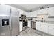 Well-equipped kitchen boasting stainless steel appliances and white cabinetry at 8024 Sunfield Ct # 5-B, Indianapolis, IN 46214