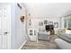 Cozy living room featuring neutral paint, plank flooring, and a staircase to the basement at 8024 Sunfield Ct # 5-B, Indianapolis, IN 46214