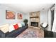 Inviting living room with a stone fireplace, comfortable seating, and stylish decor at 8024 Sunfield Ct # 5-B, Indianapolis, IN 46214