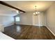 Bright living room with hardwood floors, a ceiling fan, a dining area, and lots of natural light at 8024 Sunfield Ct # 5-B, Indianapolis, IN 46214